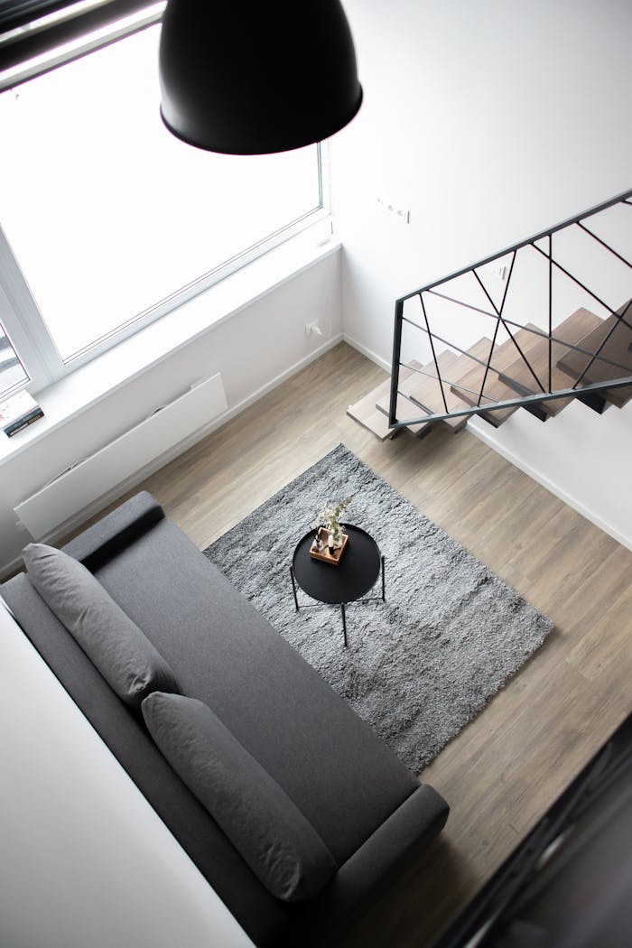 Crafting Captivating Headlines: Your awesome post title goes here Aerial view of a stylish minimalist loft with modern furnishings and elegant decor.